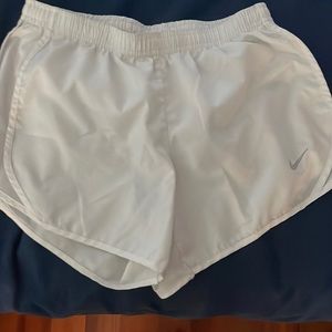 white nike shorts in size youth medium